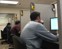Student in testing cubicle