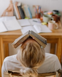Girl with book on head