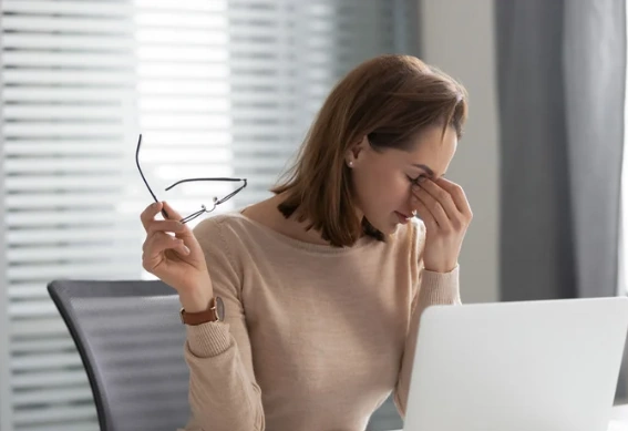 fatigued woman at desk