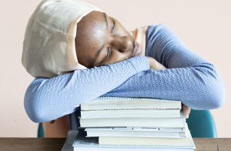 sleepy student with books
