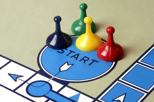 board game start square with playing pieces